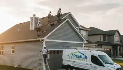 Roof repair experts fixing storm-damaged roofing on Memphis TN home exterior by Next Level Exteriors